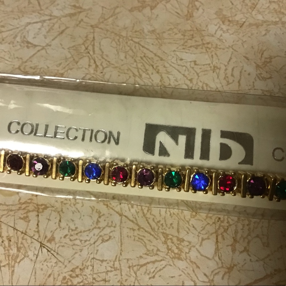 2 Tennis Bracelets  new, never worn, about 7 1/2" both are gold metal